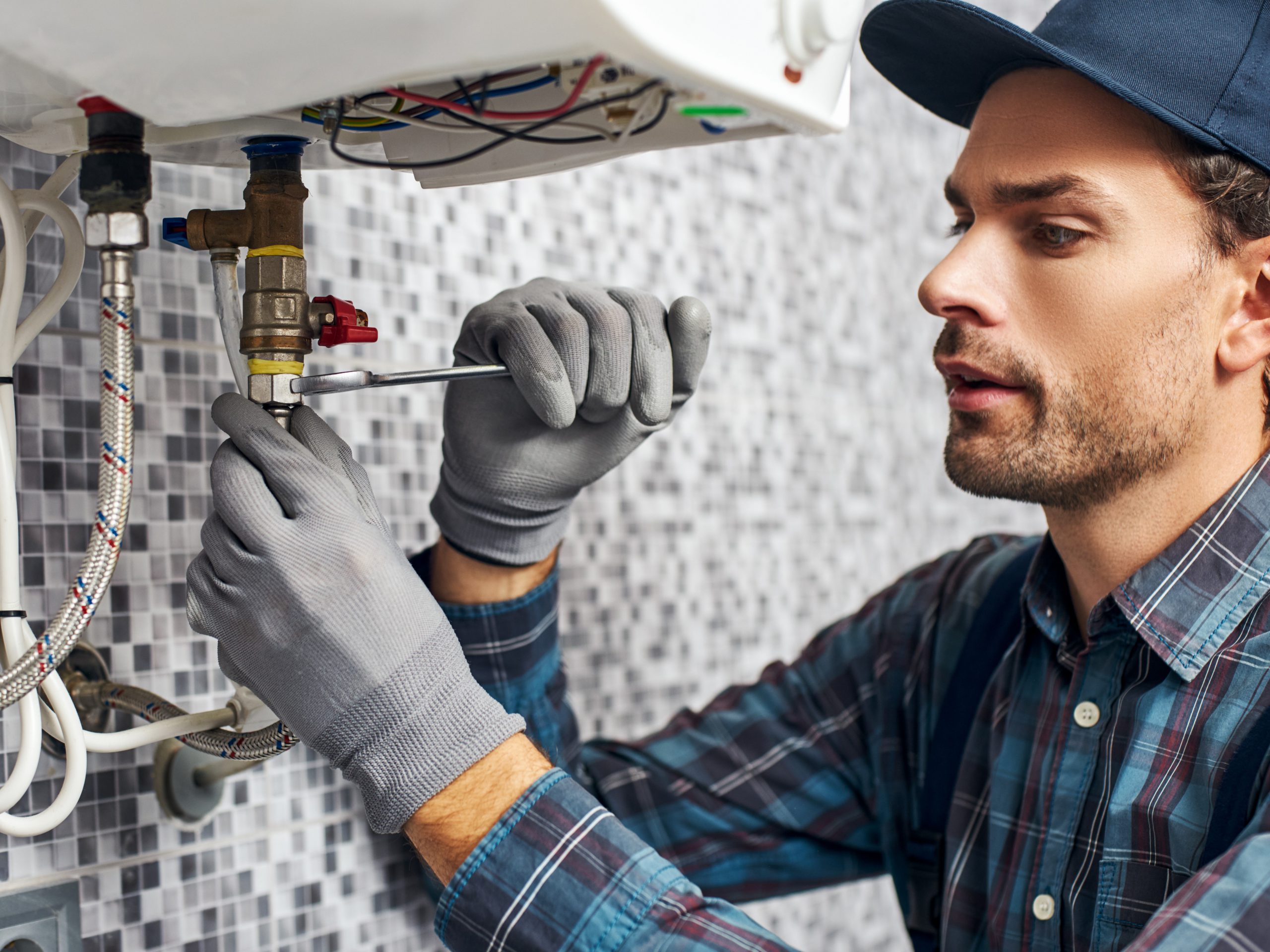 Photo of a plumber working on a job